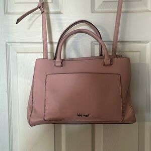 Light pink Nine West pocket book.